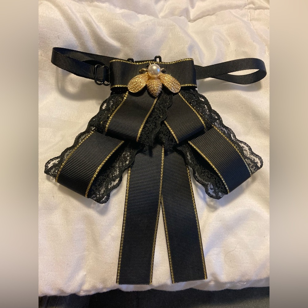 Elegant Black and Gold Bow Accessory